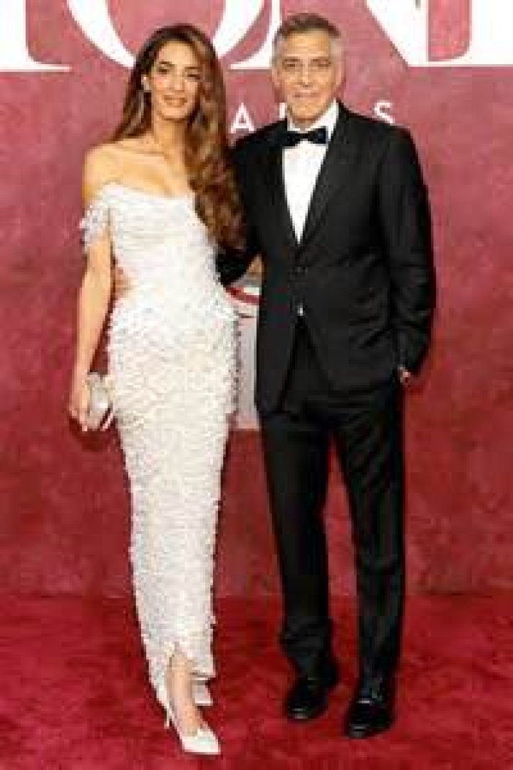 Amal Clooney's pregnancy chic wife shows off her baby bump in