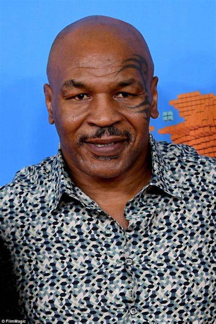 Mike Tyson dotes over his daughter Milan at the Kids' Choice Awards